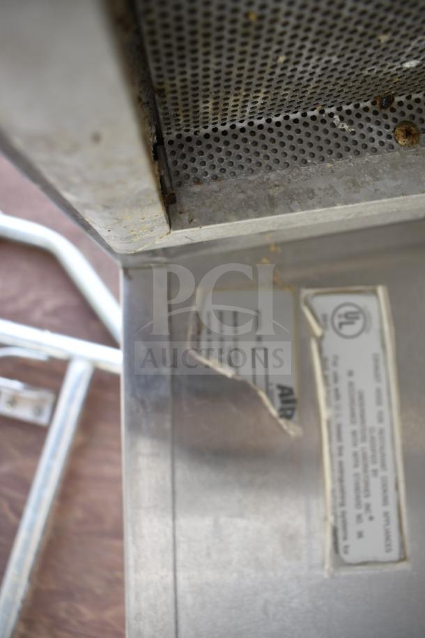 9.5 Commercial return air grease hood with filters and built-in lights. Features metal mesh and UL certification label. Used condition.