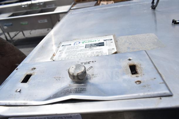 9.5 Commercial Return Air Grease Hood with filters and lights. Features metal control panel, visible maintenance label. Used condition.
