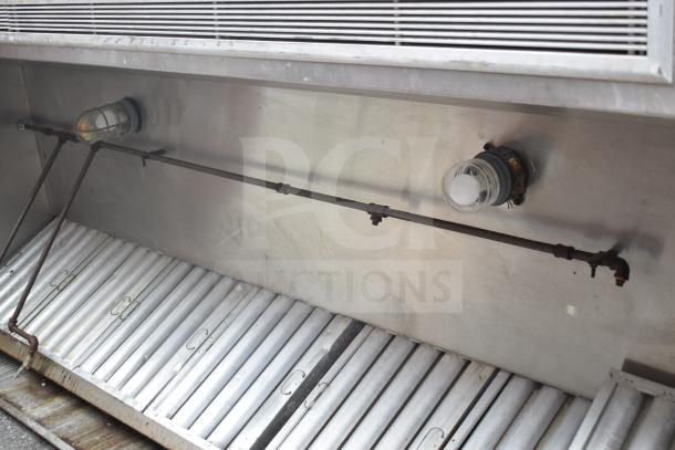 9.5 ft commercial return air grease hood with filters and lights, stainless steel, used condition, integrated lighting fixtures.