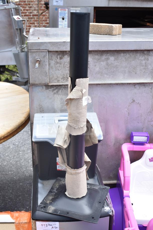 Three items: Portable file tote, two-drawer cabinet, and table base column in used condition with minor wear.