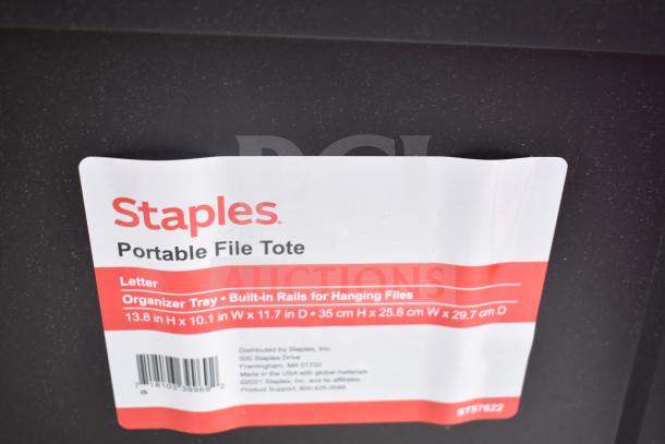 Staples portable file tote label showing dimensions and features like built-in rails for hanging files.