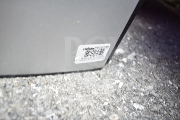 Three items: portable file tote, two-drawer cabinet, table base column. Cabinet has a white label with barcode.