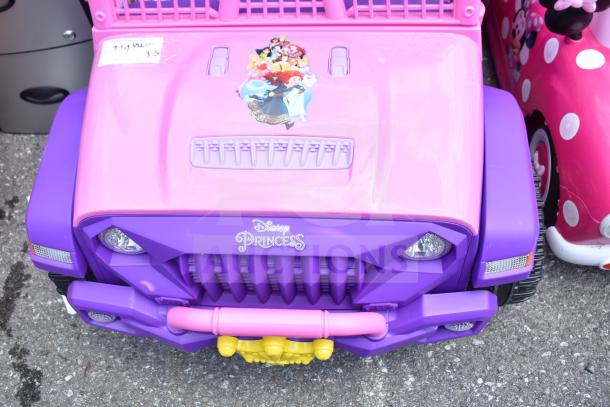 Disney Princess purple and pink children's car with characters on hood, labeled "Disney Princess," in good condition.