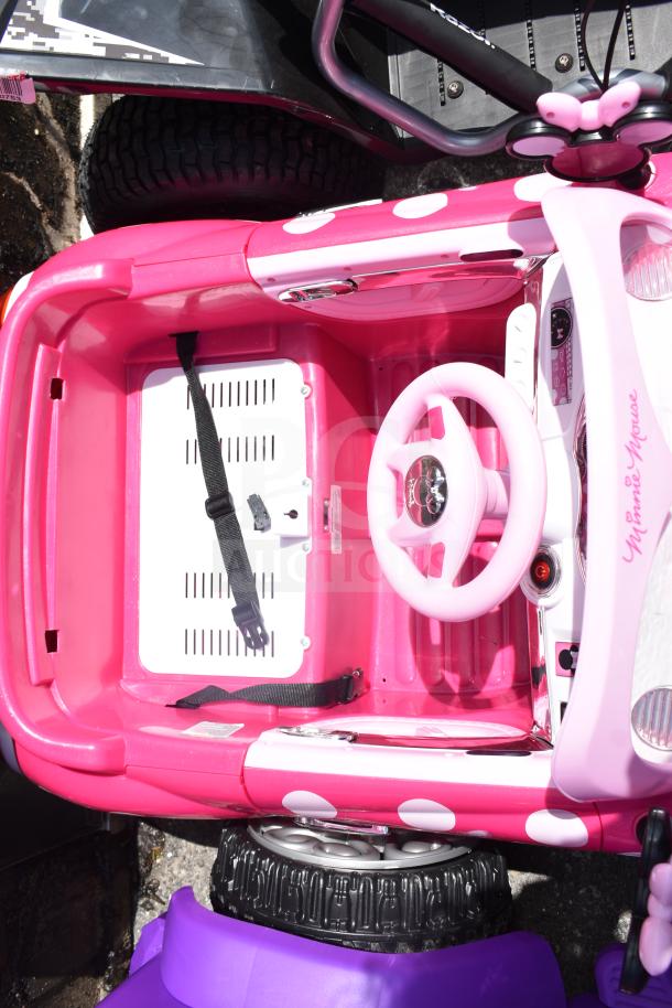 Two children's ride-on vehicles: Disney Princess purple and pink car, and Minnie Mouse pink car. Good condition.