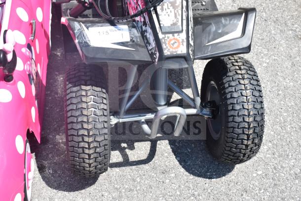 Children's ATV with rugged tires, digital camo pattern, and sturdy metal frame, suitable for outdoor play.