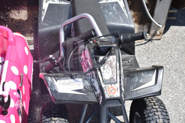 Ride On Children's ATV with digital camo design, sturdy build, and Razor branding on handle. In good condition with visible price tag.