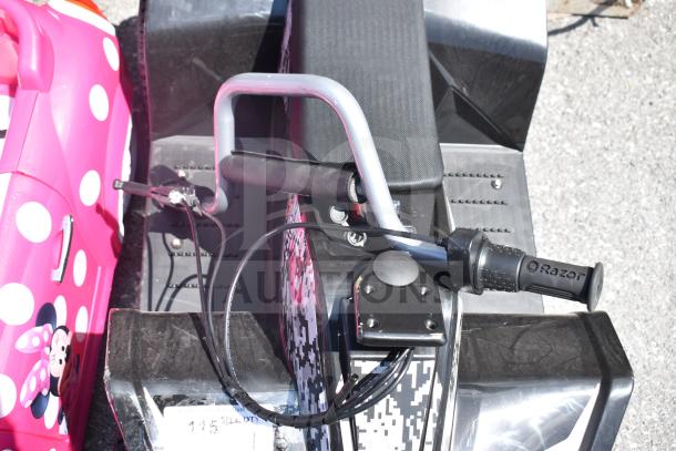 Razor children's ride-on ATV with digital camo design, black seat, and handlebar, in good condition; visible label on front.