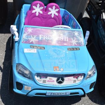 Blue Ride-On Mercedes Frozen II children's car with snowflake graphics, featuring pink seats and Disney branding. Good condition.