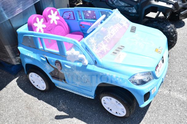 Blue Mercedes Frozen II Ride On Children's car, features pink seats and Frozen graphics, in good condition.