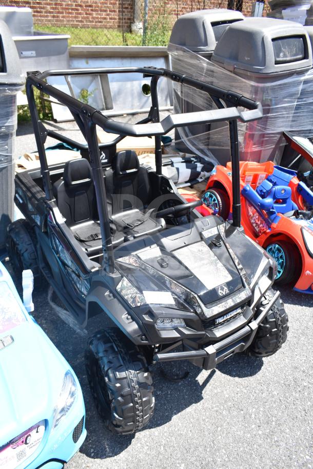 Ride On Children's Golf Cart, black, dual seats, rugged tires, steering wheel, excellent condition, outdoor play.