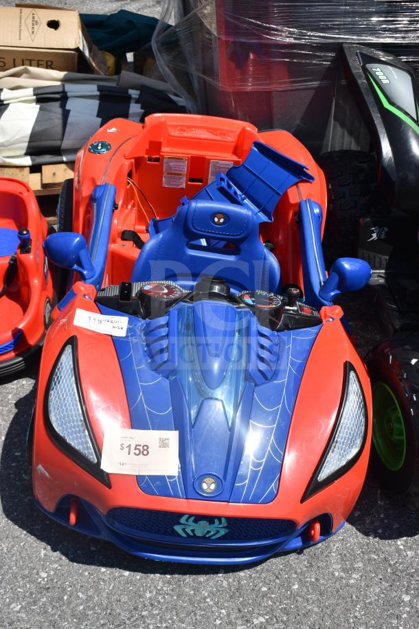 Children's ride-on Spiderman car, blue and red with spider logo, excellent condition, priced at $158. Tags attached.