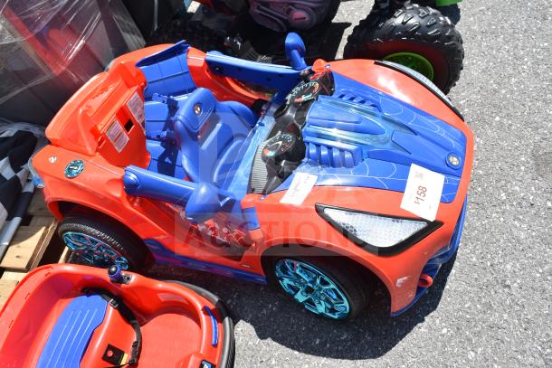2 Ride On Children's Vehicles: Spiderman-themed car with blue and red design, detailed dashboard, and hover car. Gently used.