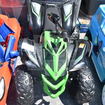 Ride On Children's Raptor ATV, green and black, rugged tires, ergonomic handlebars, visible brand logo, excellent condition.