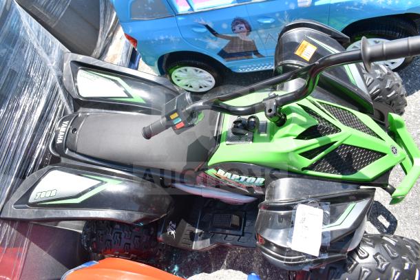 Ride On Children's Raptor ATV in green and black. Features include detailed handlebar controls and durable tires. Appears in good condition, with "Raptor" and "700R" markings visible.