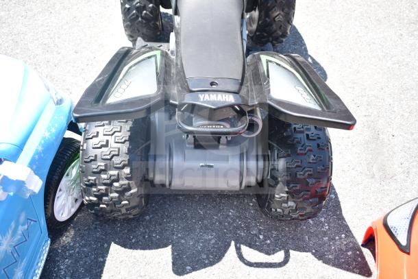 Ride On Children's Raptor ATV with large black wheels, Yamaha branding, and durable plastic body. Good used condition.