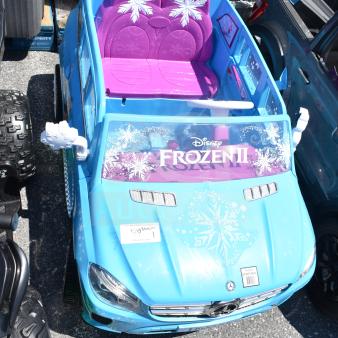 Children's Mercedes Frozen II ride-on blue car with snowflake decals, purple seats, and Mercedes emblem. Great condition.