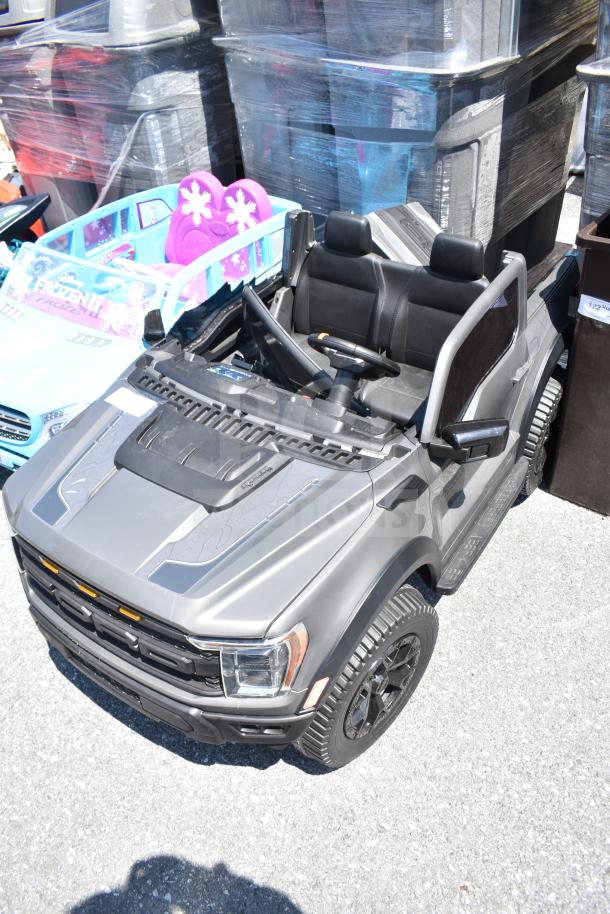 Ride On Children's Ford Gray Car, detailed design, realistic features, black seats, excellent condition.
