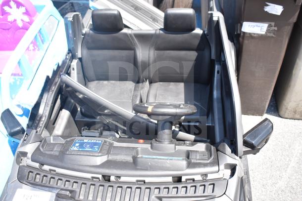 Ride On Children's Ford Gray Car with dual seats and steering wheel, slight wear visible, ideal for young drivers.