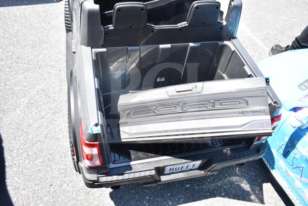 Ride On Children's Ford Gray Car, featuring Ford branding and spacious truck bed, in good condition.