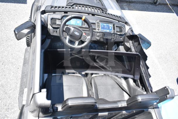Ride On Children's Ford Gray Car, detailed dashboard, steering wheel, seatbelts, and realistic interior features visible.