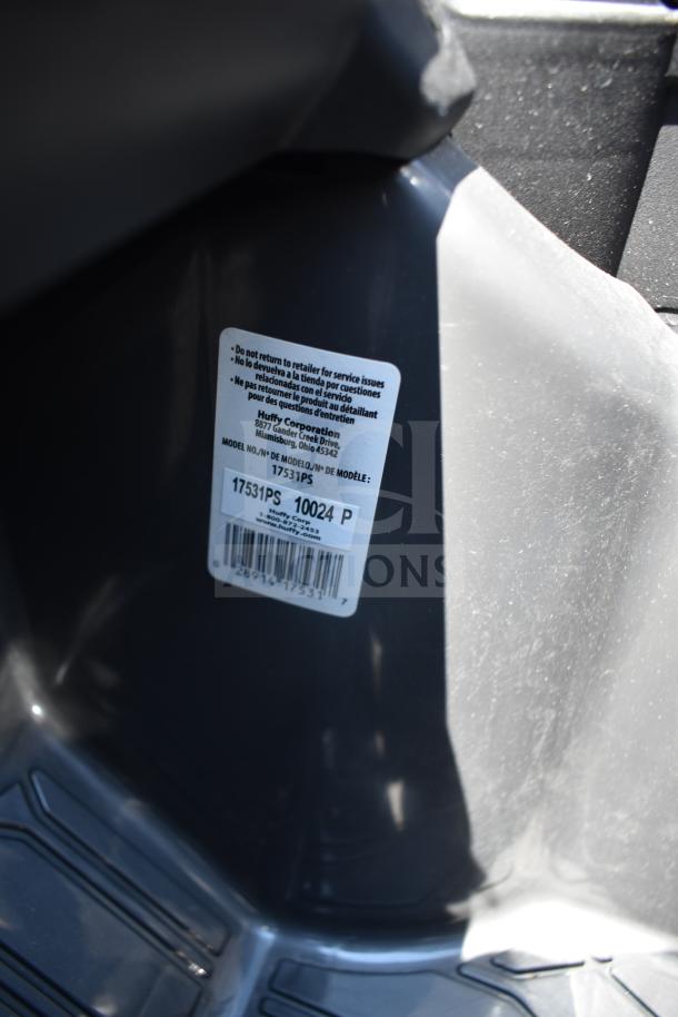 Gray ride-on children's car with visible label. Model: 17531PS by Huffy Corporation. Mint condition.