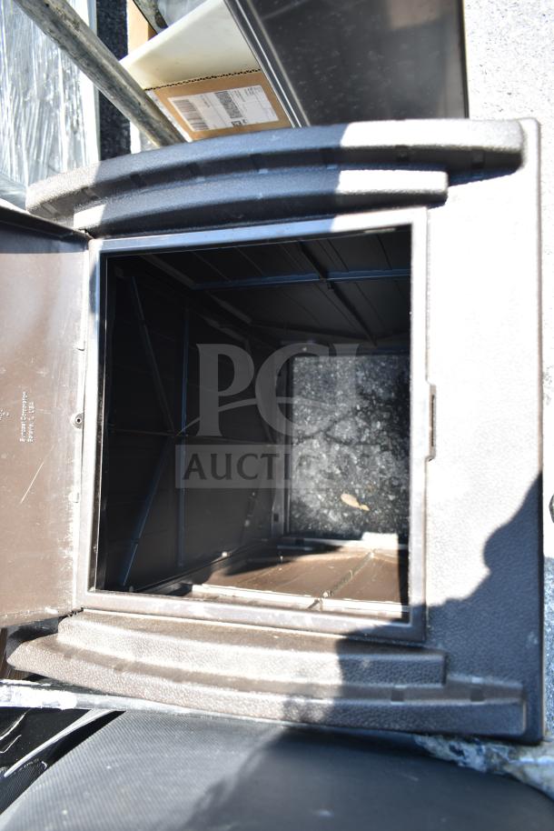 Slim Jim trash can in open position, black color, textured finish, included with mats, part of a 6-item auction lot.