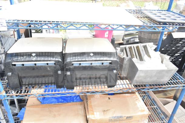 Chrome 4-tier wire shelving unit on commercial casters with contents; buyer must dismantle; freight charges apply.