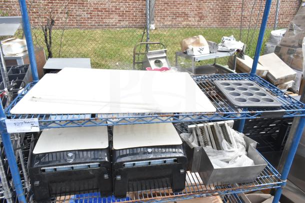 Chrome finish 4-tier wire shelving unit on commercial casters with assorted contents. Buyer must dismantle for shipping.