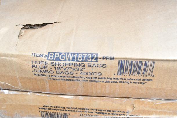 Cardboard box labeled "Item #BPGW18732 PRM," containing HDPE blue jumbo shopping bags, dimensions 18"x7"x32", 400 per case.