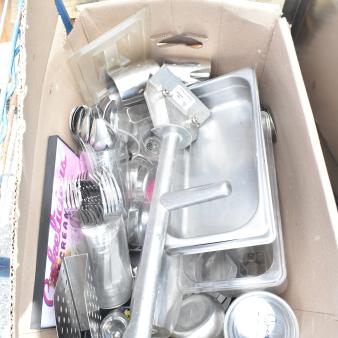 Boxed lot containing assorted kitchen items, including metal trays, utensils, and bins. Condition varies.