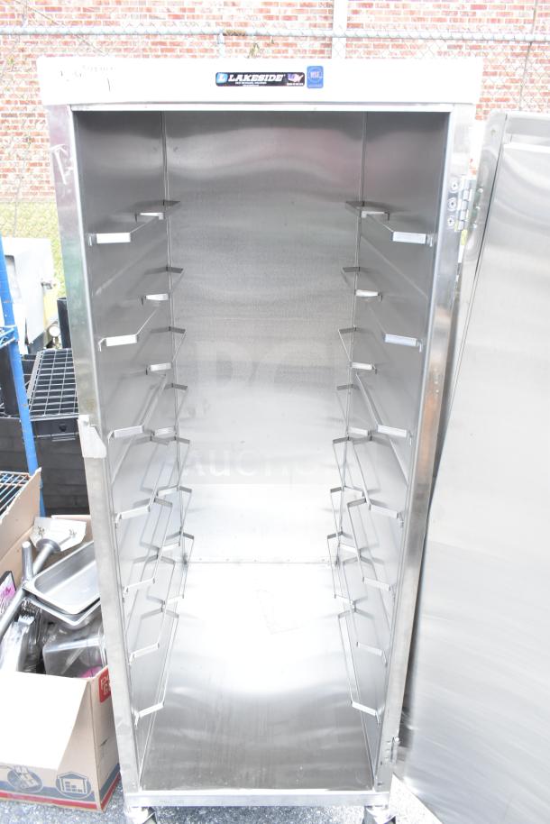 Lakeside commercial enclosed pan transport rack, stainless steel, on heavy-duty casters, NSF label visible.