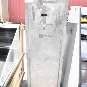 Commercial enclosed pan transport rack on casters, metal finish, used condition, visible label reads "135 Max OTY."