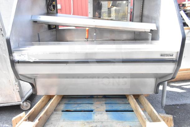 Custom's Deli Equipment commercial floor merchandiser display case in stainless steel. Good condition, ideal for deli use.