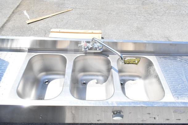 Krowne 18-63C Commercial 3 Bay Back Bar Sink with dual drain boards, stainless steel, used condition, faucet included.