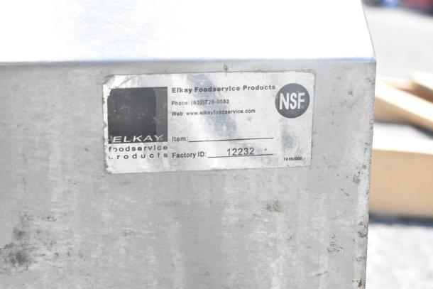 Elkay Foodservice Products NSF-labeled commercial dishwasher table with Factory ID 12232, visible wear.
