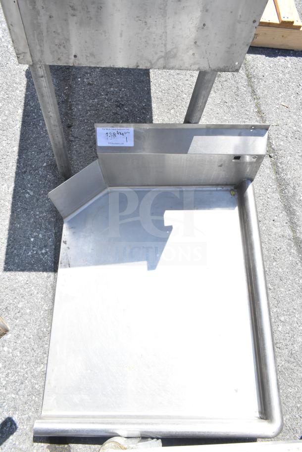 Commercial stainless steel right side clean side dishwasher table with raised edges. Used condition. Item tag visible.