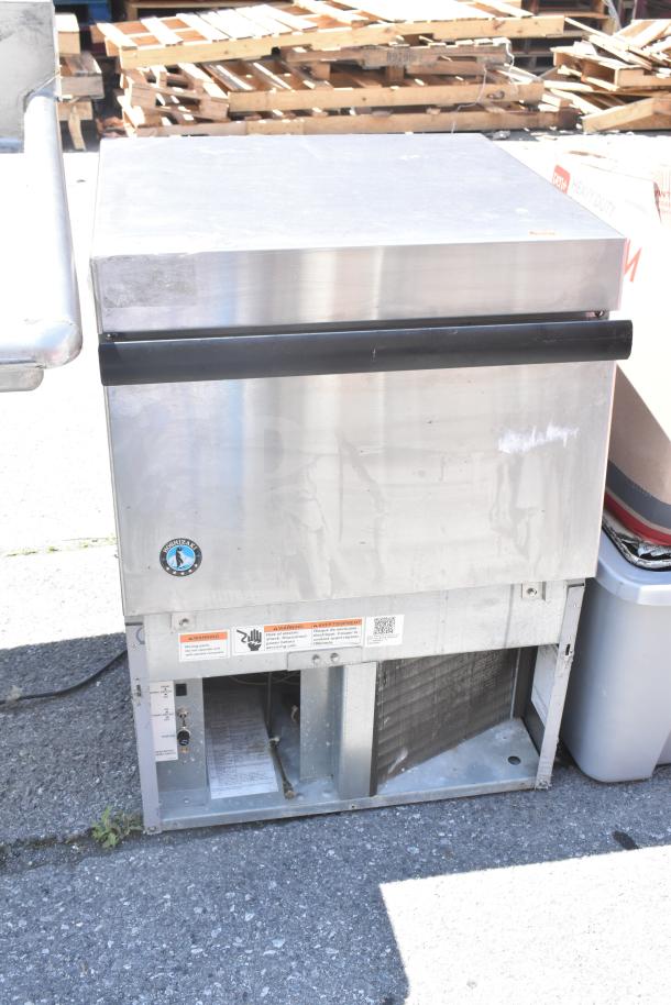 Hoshizaki Commercial Self Contained Ice Machine in stainless steel. Shows brand logo and precautionary labels. Good condition.