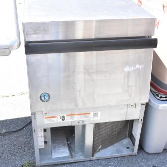 Hoshizaki Commercial Self Contained Ice Machine in stainless steel. Shows brand logo and precautionary labels. Good condition.