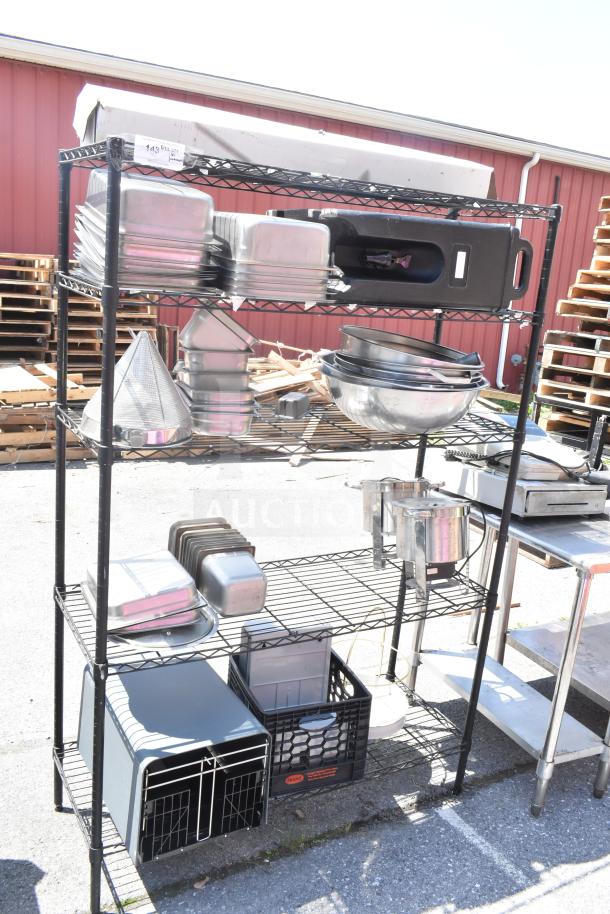 Black 5-tier wire shelving unit with various kitchen items, including pans and bowls. Requires buyer dismantling.