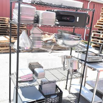 Black 5-tier wire shelving unit with various kitchen items, including pans and bowls. Requires buyer dismantling.