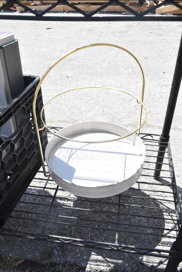 Black 5-tier wire shelving unit with contents. Buyer to dismantle. Consider freight charges. Item on pavement.