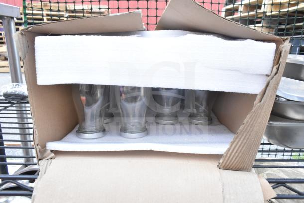 Chrome and black 6-tier wire shelving unit with boxed contents, buyer to dismantle, freight charges apply.