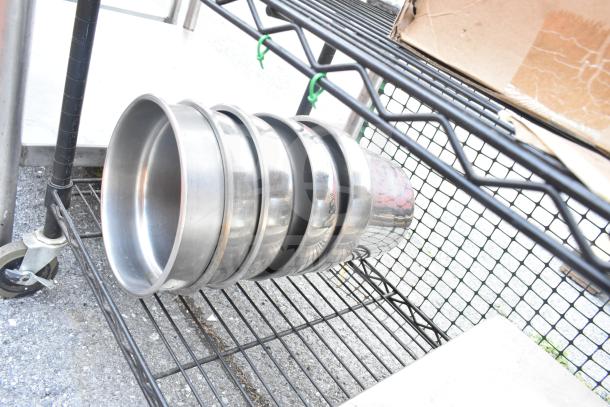 Chrome and black 6-tier wire shelving unit with contents, including metal bowls. Buyer must dismantle. Freight required.