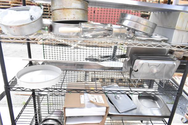 Chrome and black finish 6-tier wire shelving unit with mixed contents, including baking pans and trays. Buyer must dismantle.