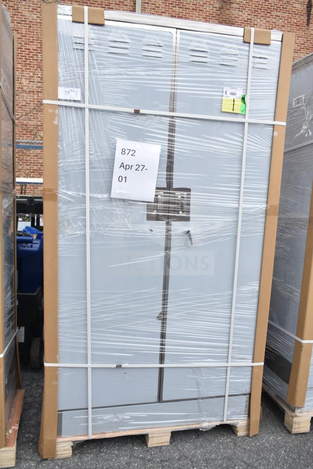 Brand new Regency 600SMC48DDM 48" stainless steel mop sink cabinet, wrapped, slight dents, April 27 label visible.
