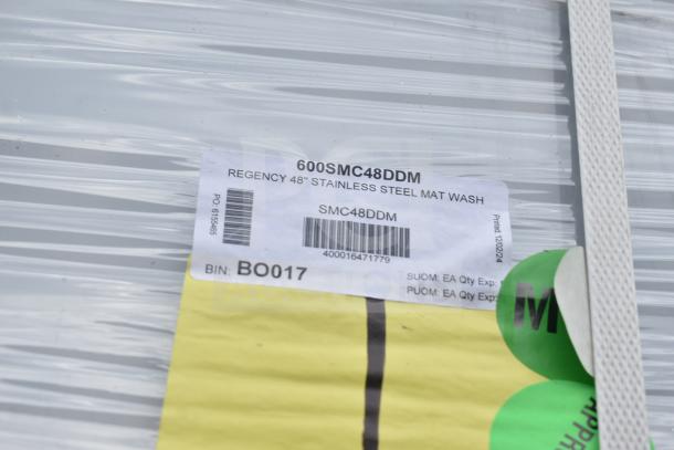 Regency 48" Stainless Steel Mop Sink Cabinet, model 600SMC48DDM, new with scratch and dent. Tags show item details and barcode.