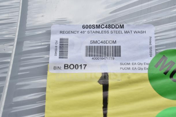 Brand new Regency 600SMC48DDM 48" stainless steel mop sink cabinet, scratch and dent model. Label shows model and bin info.