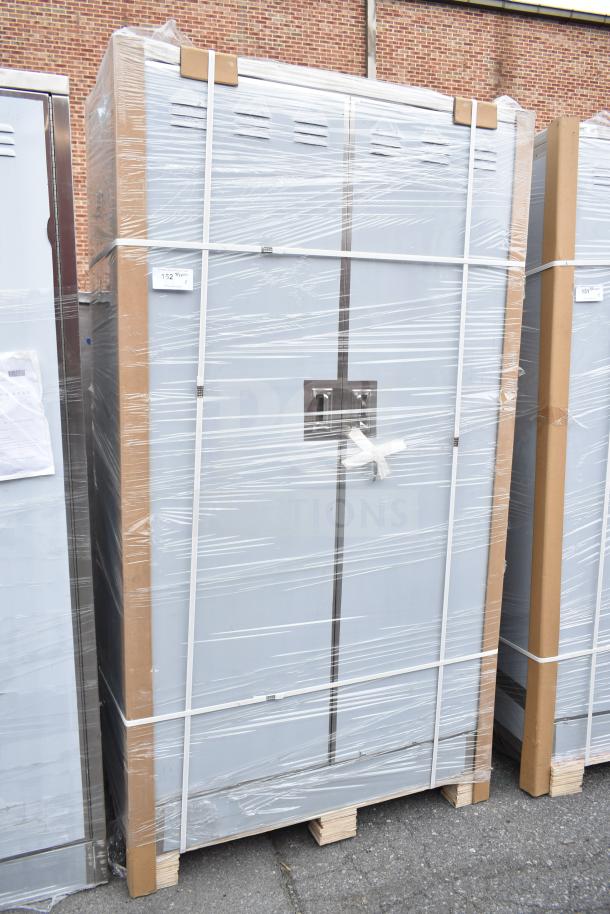Regency 48" stainless steel mop sink cabinet, wrapped in plastic, new condition with minor scratches and dents visible.