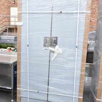 Brand new Regency 600SMC48DDM 48" stainless steel mop sink cabinet, wrapped, scratch and dent marked, on wooden pallet.