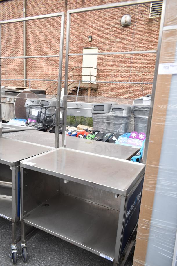 Commercial stainless steel cart with under shelf and commercial casters. Well-maintained, ideal for heavy-duty use.